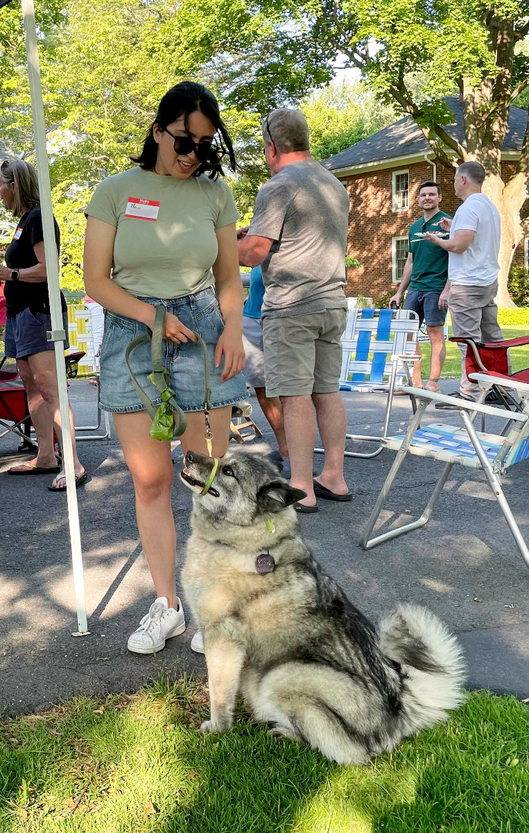 Woman with Norwegian Elkhound dog who is the best girl in the world